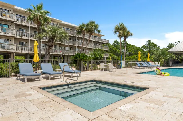 a view of a patio with a table and chairs