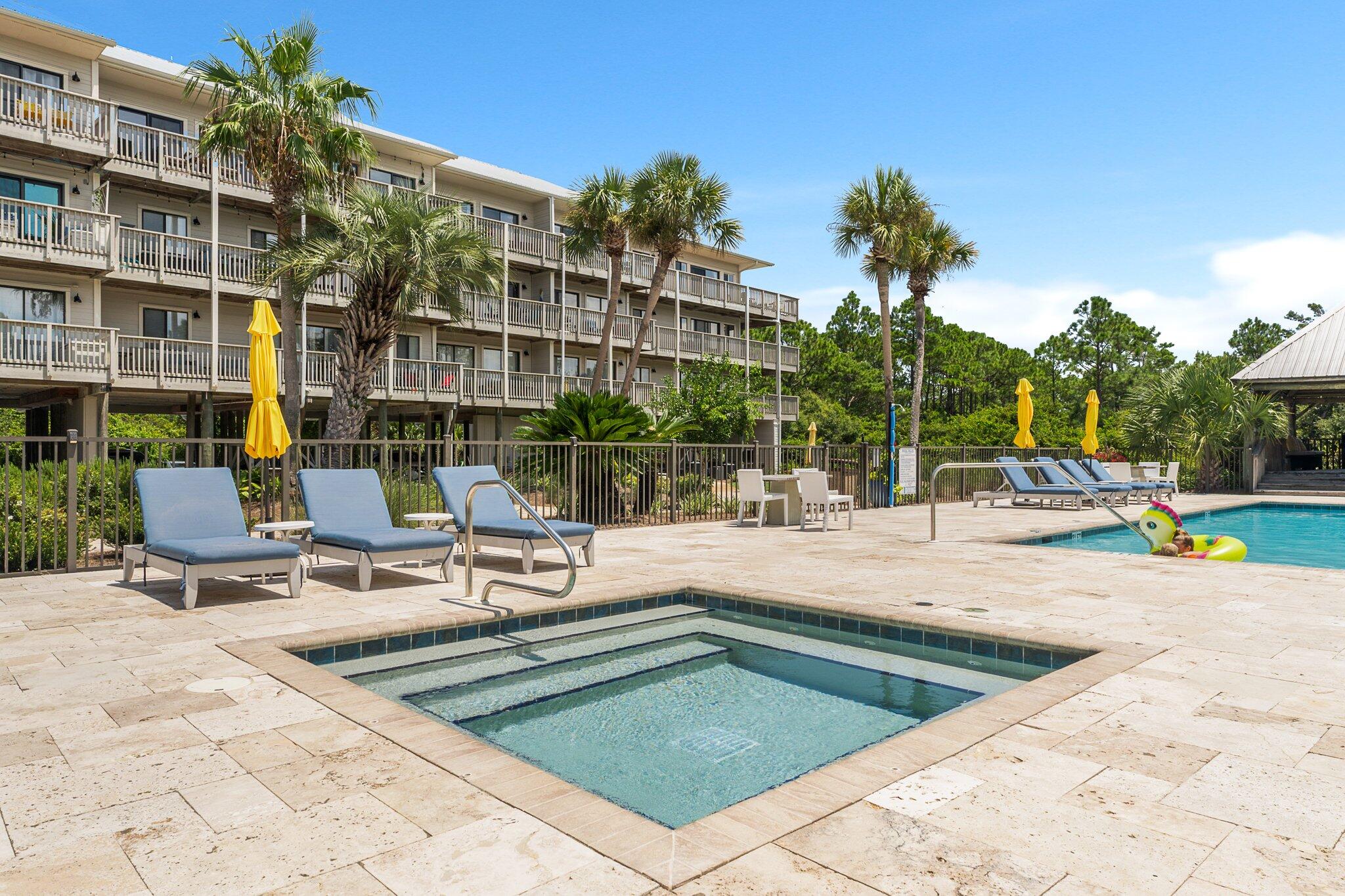 145 Beachfront Trail, Unit 302 Santa Rosa Beach, FL 32459 - Photo 27 of 42 a view of a patio with a table and chairs
