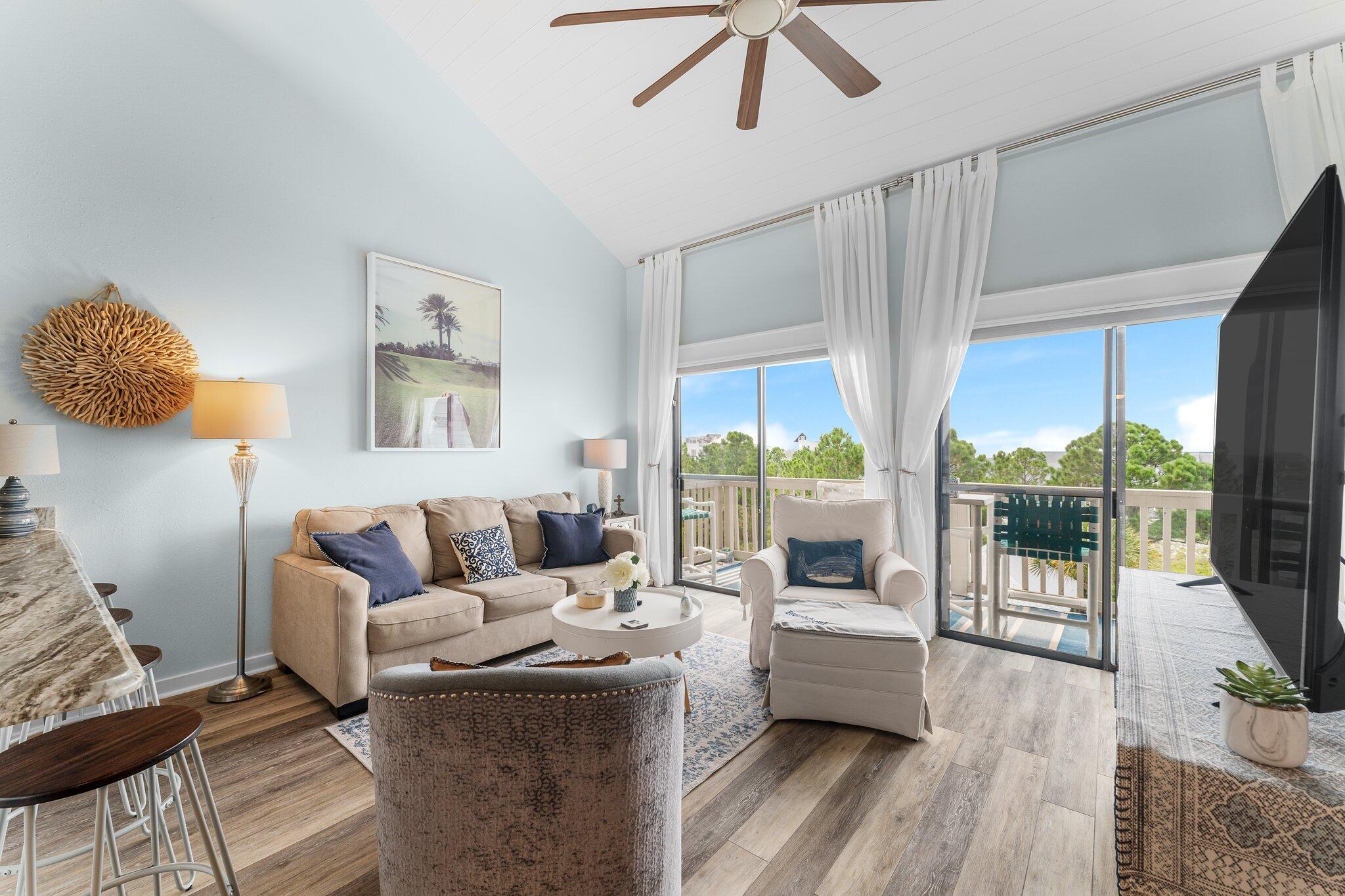 145 Beachfront Trail, Unit 302 Santa Rosa Beach, FL 32459 - Photo 5 of 42 a living room with furniture and a large window