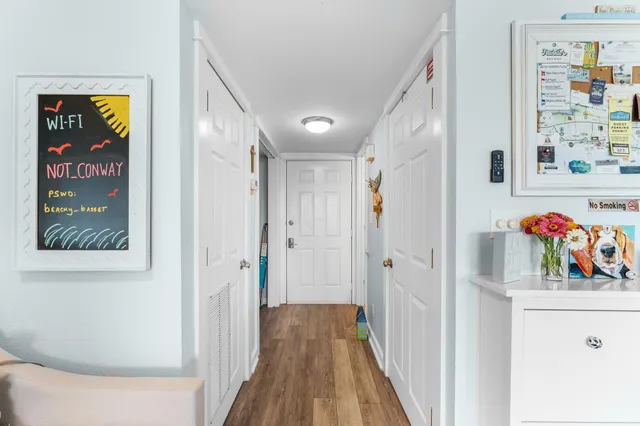 a view of a hallway with wooden shelves
