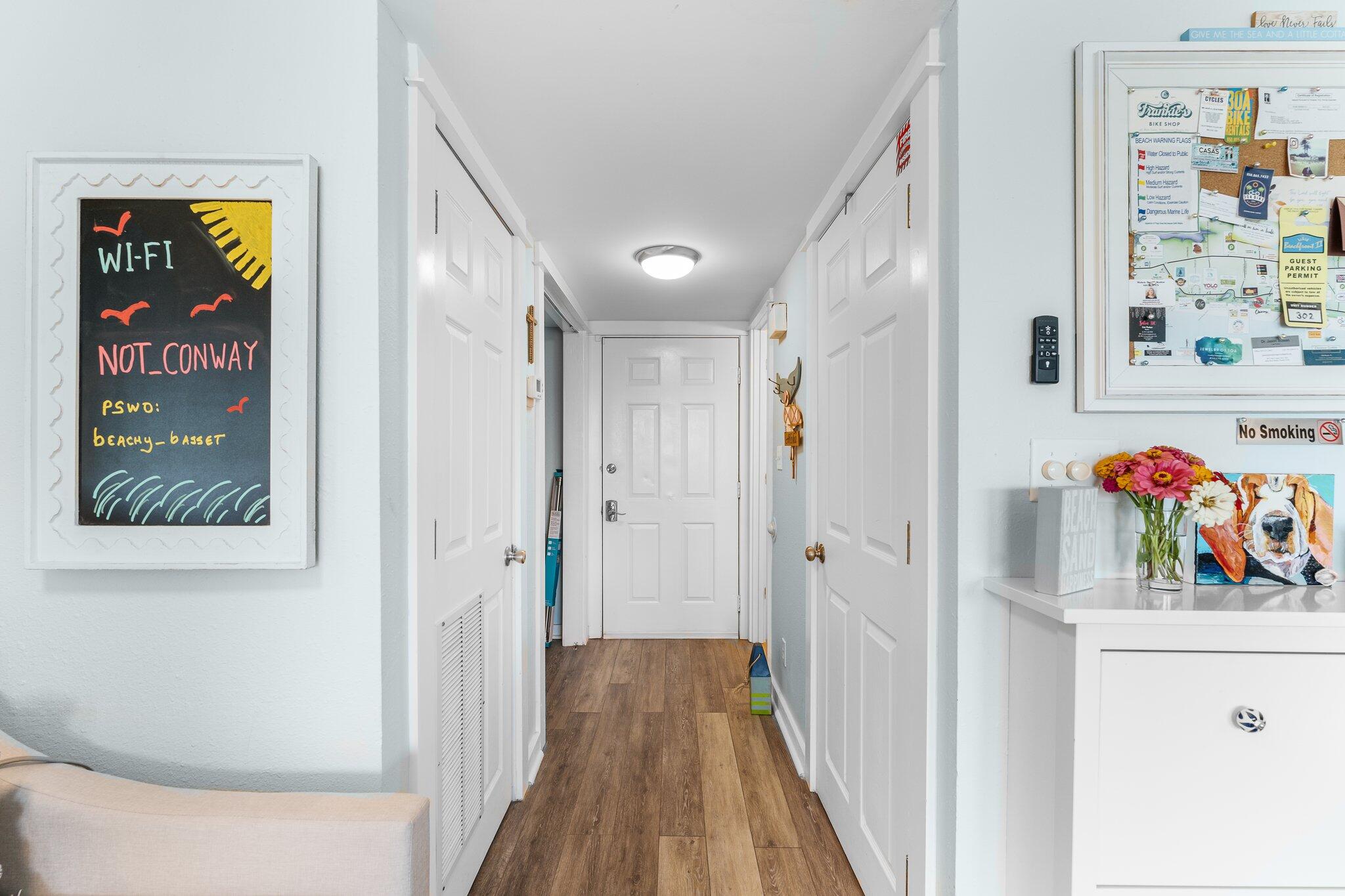 145 Beachfront Trail, Unit 302 Santa Rosa Beach, FL 32459 - Photo 6 of 42 a view of a hallway with wooden shelves