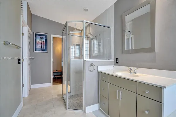 a bathroom with a sink and mirror