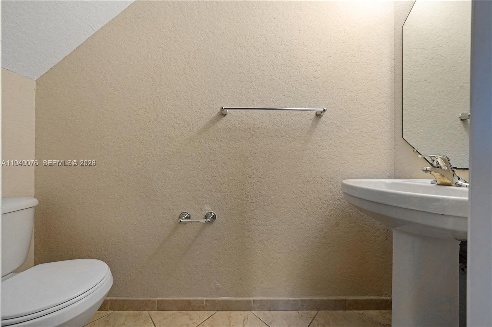 3533 Sonoma Drive Riviera Beach, FL 33404 - Photo 12 of 34 a bathroom with a sink a toilet and shower