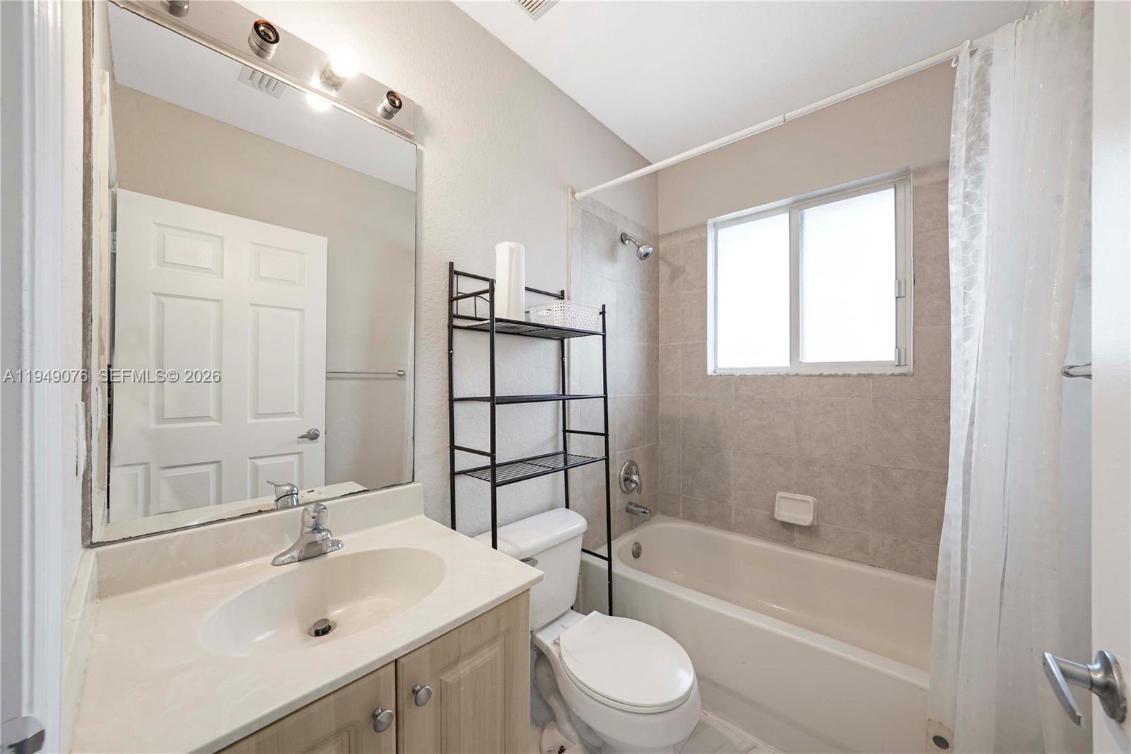 3533 Sonoma Drive Riviera Beach, FL 33404 - Photo 20 of 34 a bathroom with a sink toilet and shower