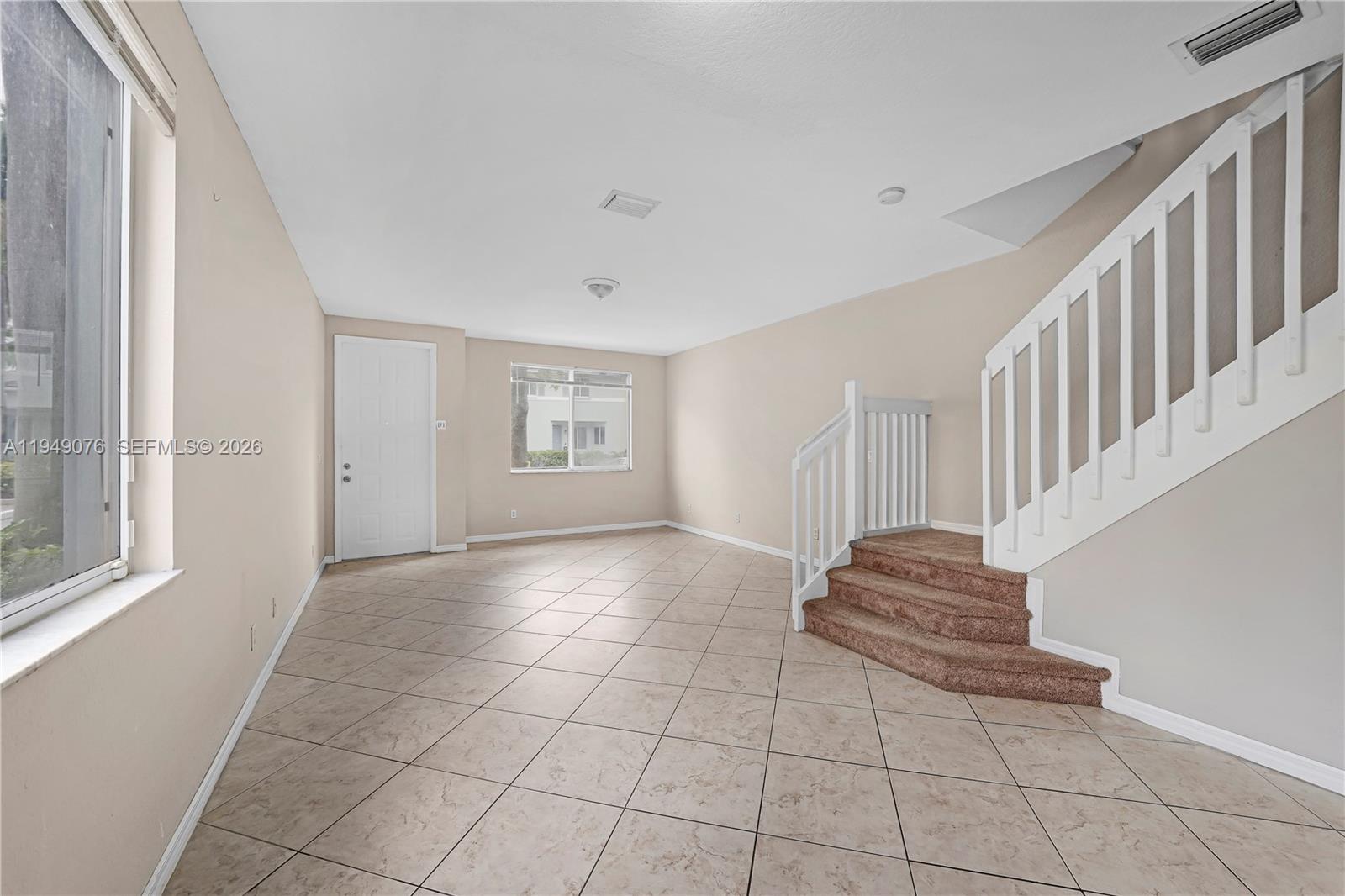 3533 Sonoma Drive Riviera Beach, FL 33404 - Photo 2 of 34 a view of entryway and hall with a window