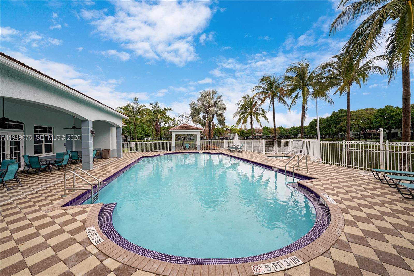 3533 Sonoma Drive Riviera Beach, FL 33404 - Photo 26 of 34 a view of a swimming pool with a lounge chair