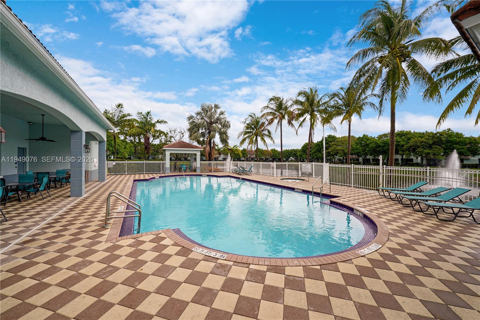 3533 Sonoma Drive Riviera Beach, FL 33404 - Photo 27 of 34 a view of a swimming pool with a lounge chair