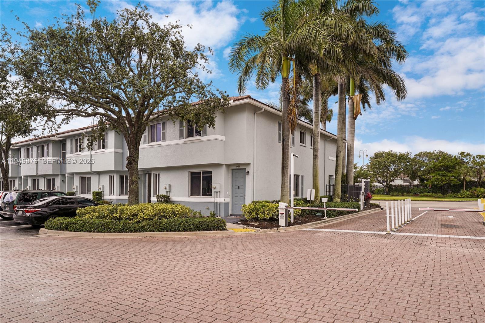 3533 Sonoma Drive Riviera Beach, FL 33404 - Photo 33 of 34 a front view of multiple houses with yard