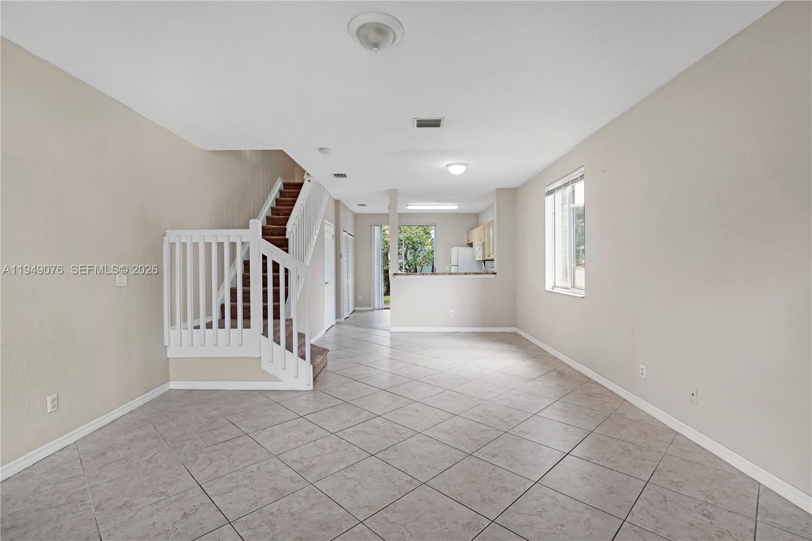 3533 Sonoma Drive Riviera Beach, FL 33404 - Photo 4 of 34 a view of entryway with stairs and a window