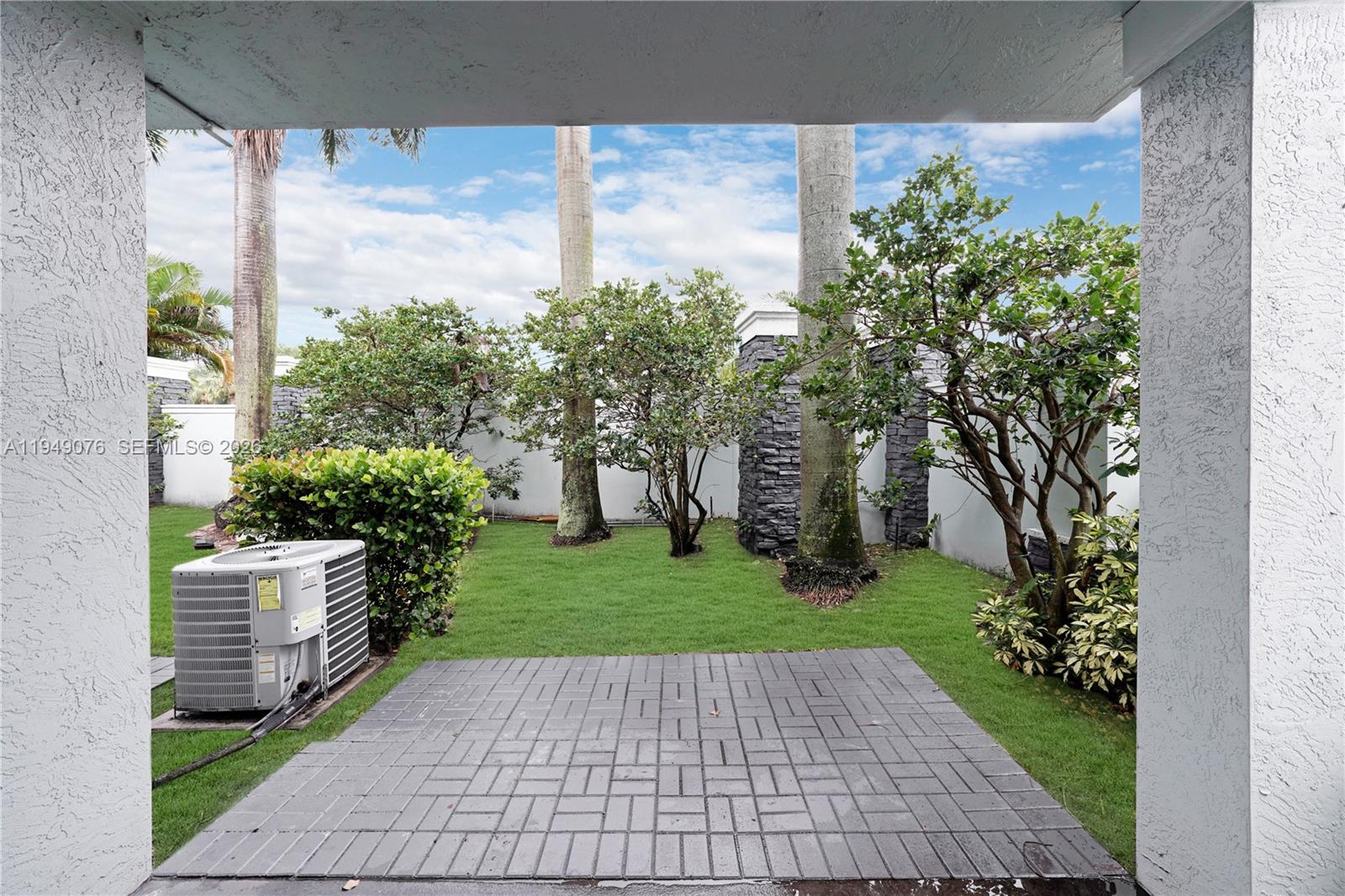 3533 Sonoma Drive Riviera Beach, FL 33404 - Photo 9 of 34 a view of backyard with plants and trees