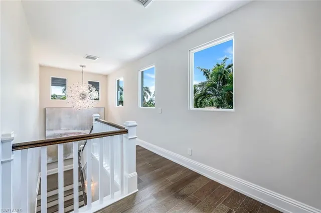 a view of entryway with wooden floor and stairs