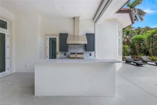 a view of living room with furniture and large window