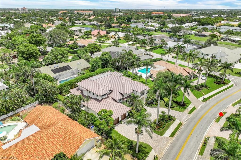 569 Neapolitan Way Naples, FL 34103 - Photo 46 of 50 an aerial view of residential houses with outdoor space