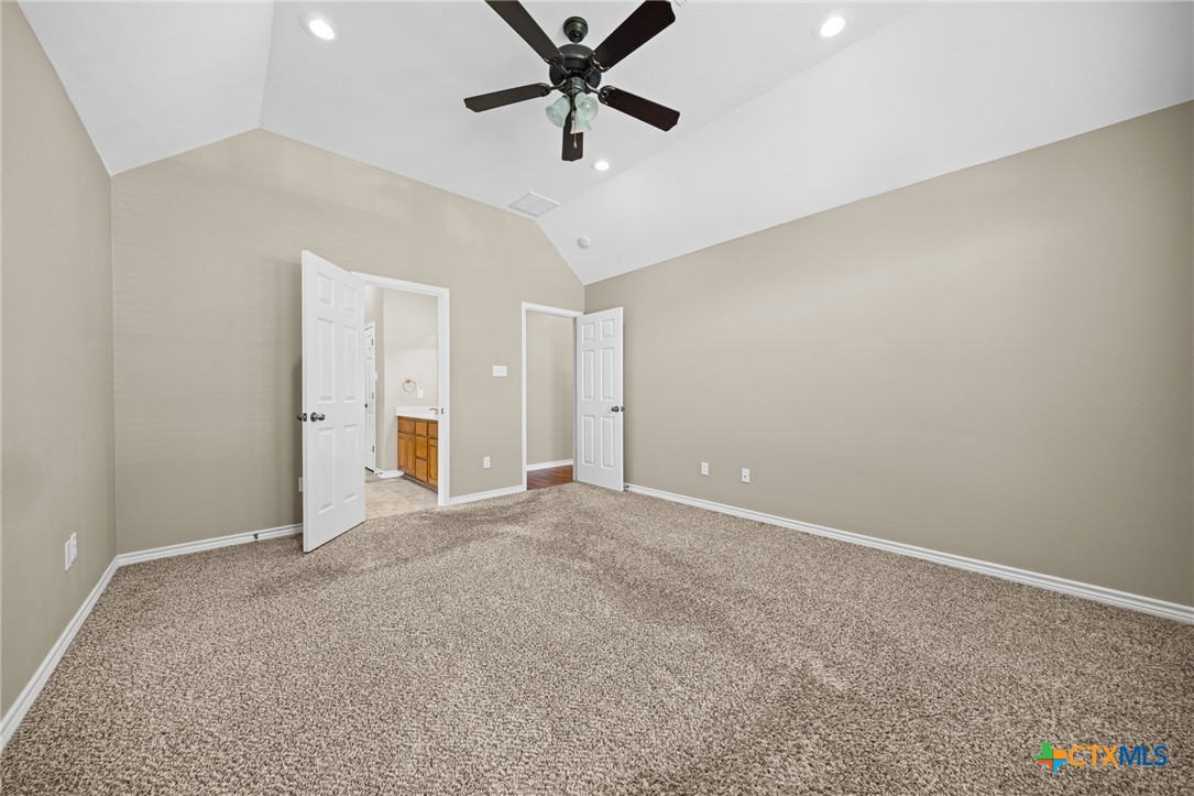 2807 Amber Forest Trail Belton, TX 76513 - Photo 24 of 40 an empty room with closet and a ceiling fan