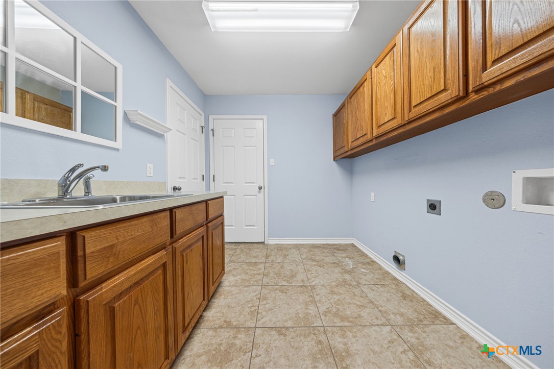 2807 Amber Forest Trail Belton, TX 76513 - Photo 30 of 40 a kitchen with stainless steel appliances granite countertop a sink and cabinets