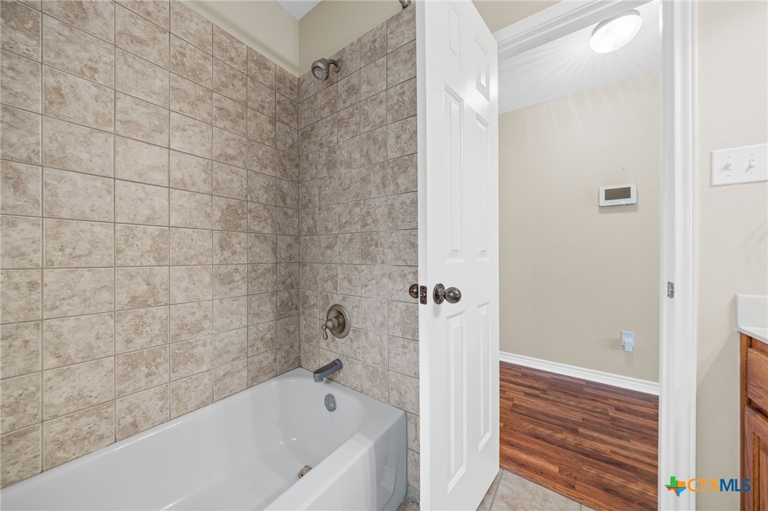 2807 Amber Forest Trail Belton, TX 76513 - Photo 32 of 40 a bathroom with a bathtub and shower
