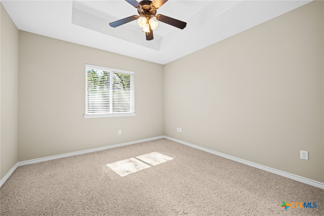 2807 Amber Forest Trail Belton, TX 76513 - Photo 33 of 40 an empty room with a window and a fan