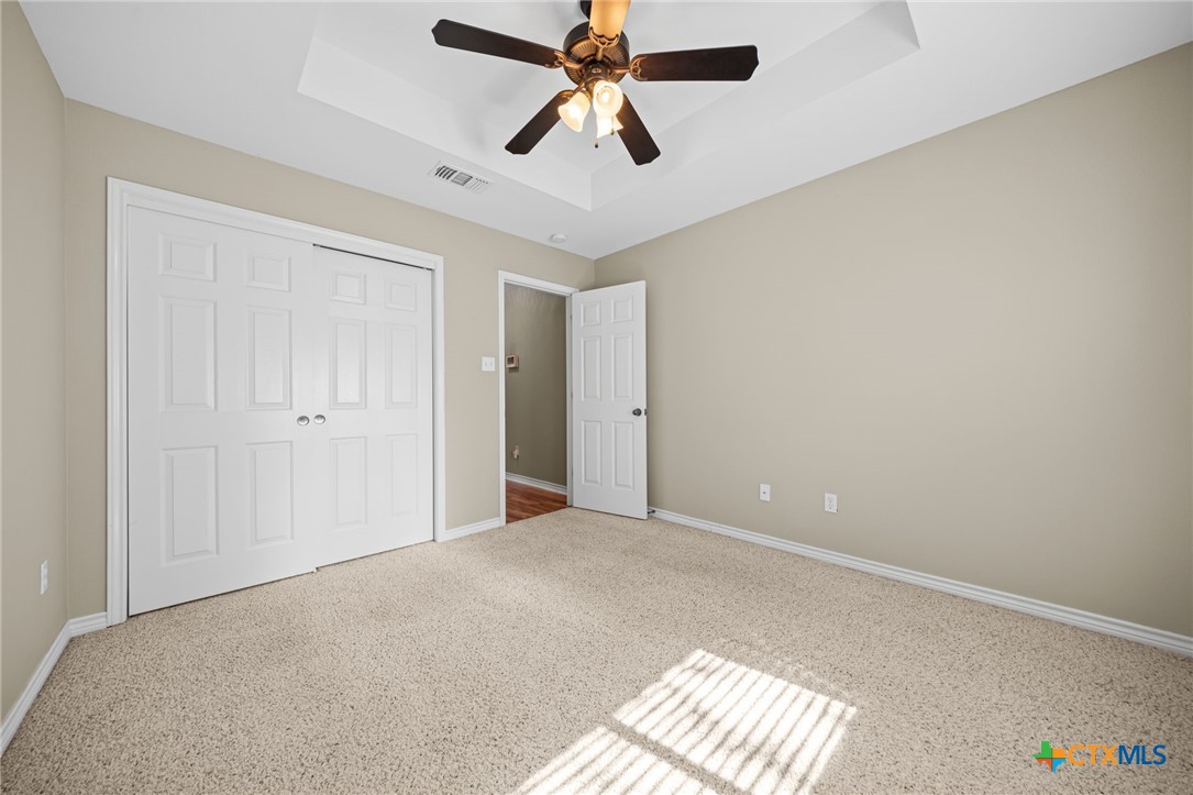 2807 Amber Forest Trail Belton, TX 76513 - Photo 34 of 40 an empty room with windows and fan