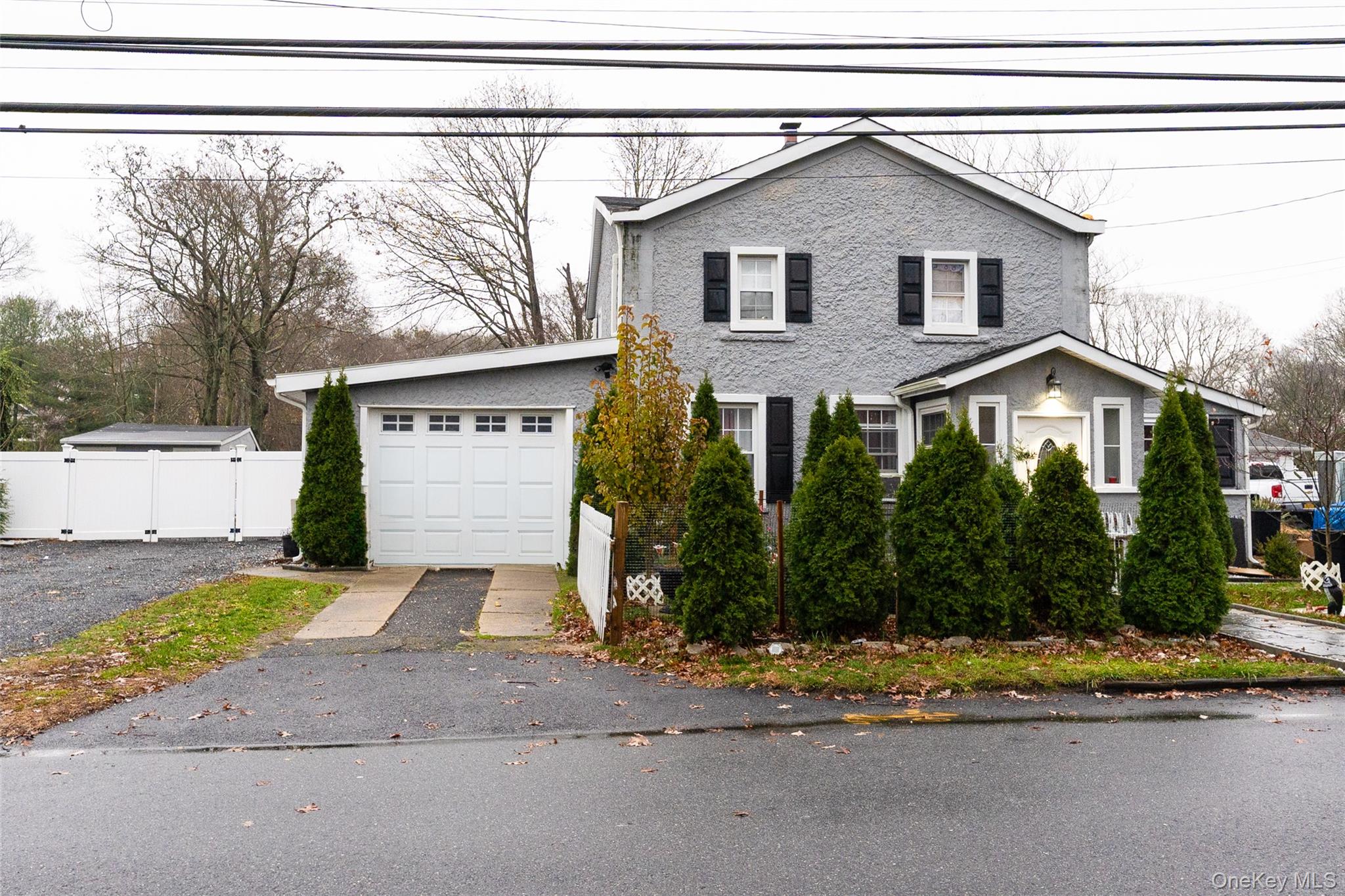163 Orchard Road East Patchogue, NY 11772 - Photo 1 of 26 View of front of home featuring asphalt driveway