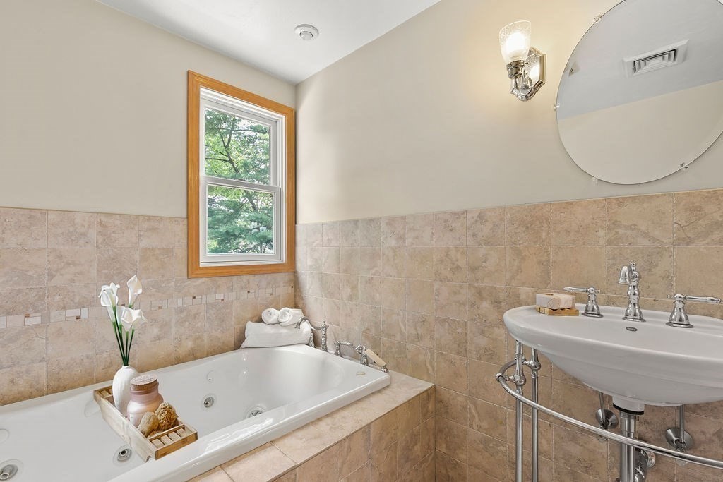 11 Amherst Road Stoughton, MA 02072 - Photo 12 of 42 a bathroom with a sink and a bathtub