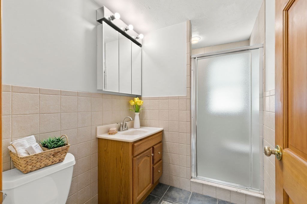 11 Amherst Road Stoughton, MA 02072 - Photo 15 of 42 a bathroom with a sink toilet and shower