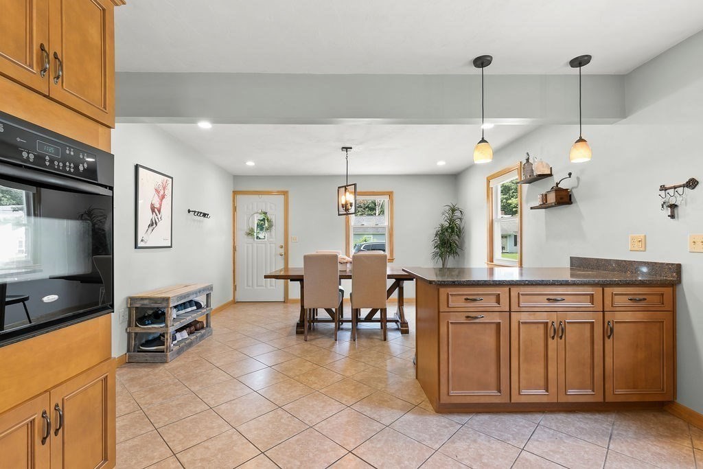 11 Amherst Road Stoughton, MA 02072 - Photo 27 of 42 a open kitchen with cabinets and chairs