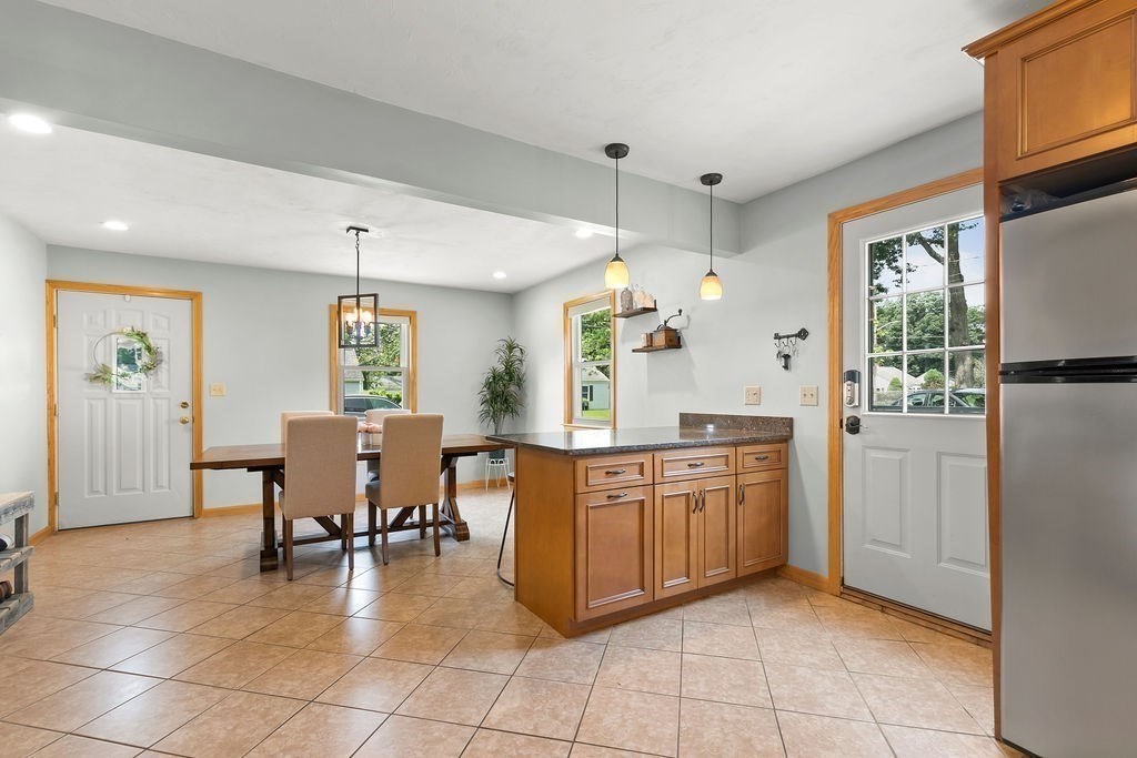 11 Amherst Road Stoughton, MA 02072 - Photo 28 of 42 a kitchen with stainless steel appliances granite countertop a refrigerator and microwave