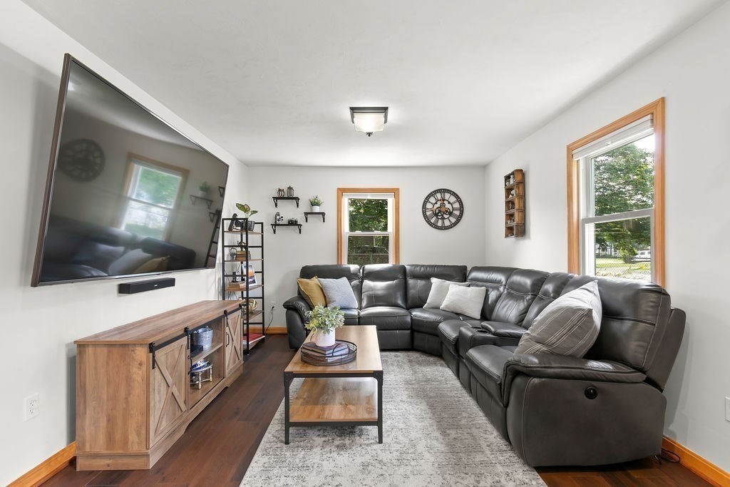 11 Amherst Road Stoughton, MA 02072 - Photo 30 of 42 a living room with furniture and a flat screen tv