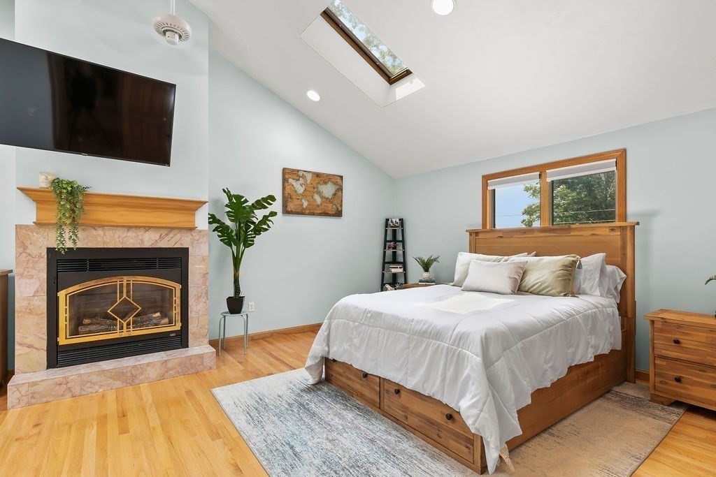 11 Amherst Road Stoughton, MA 02072 - Photo 3 of 42 a bedroom with a bed and a flat screen tv