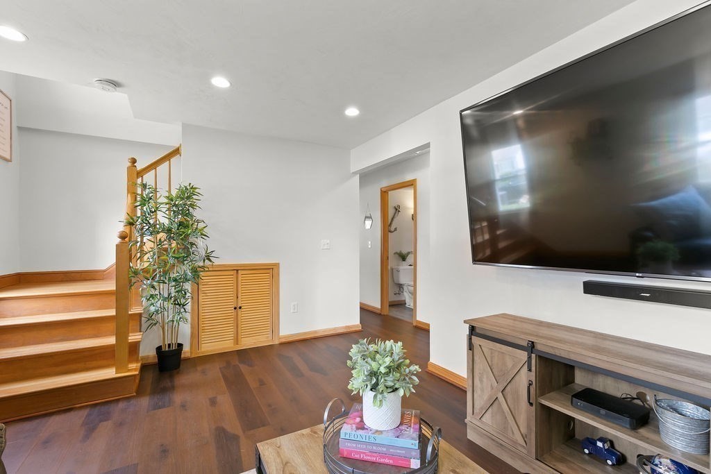 11 Amherst Road Stoughton, MA 02072 - Photo 33 of 42 a living room with furniture and a flat screen tv