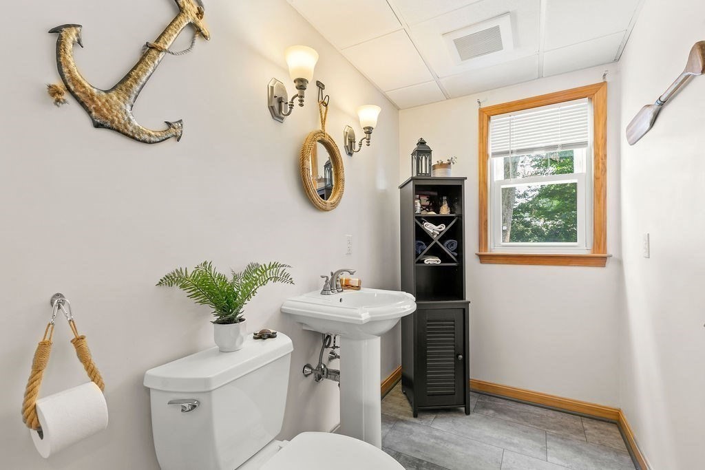 11 Amherst Road Stoughton, MA 02072 - Photo 34 of 42 a bathroom with a sink mirror and toilet