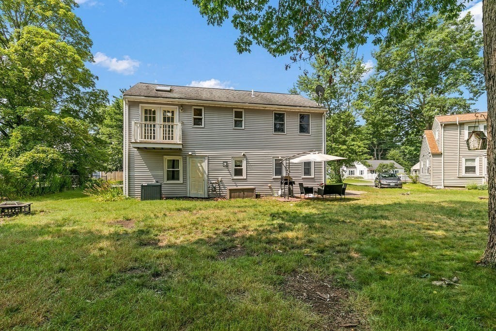 11 Amherst Road Stoughton, MA 02072 - Photo 37 of 42 a front view of house with yard and trees