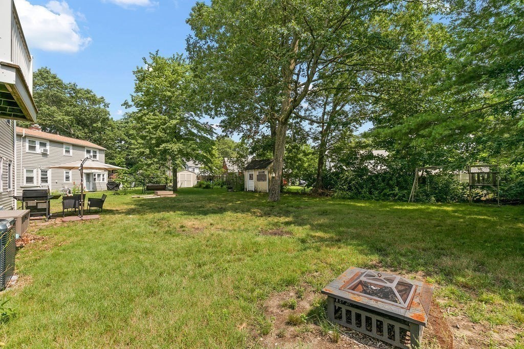 11 Amherst Road Stoughton, MA 02072 - Photo 38 of 42 a view of a house with a backyard