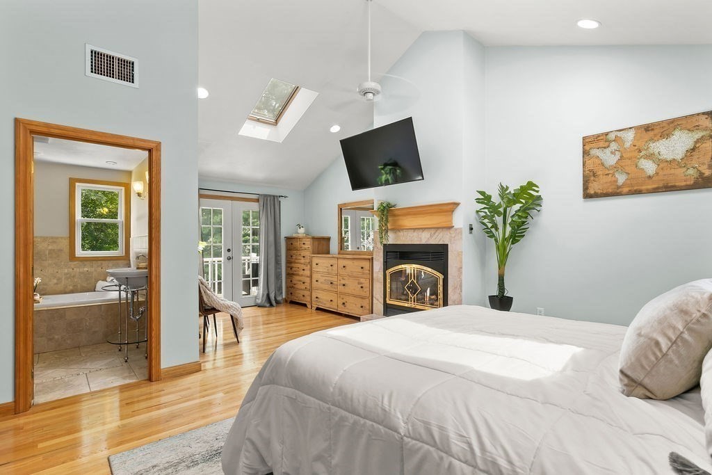 11 Amherst Road Stoughton, MA 02072 - Photo 4 of 42 a spacious bedroom with a bed and a flat screen tv