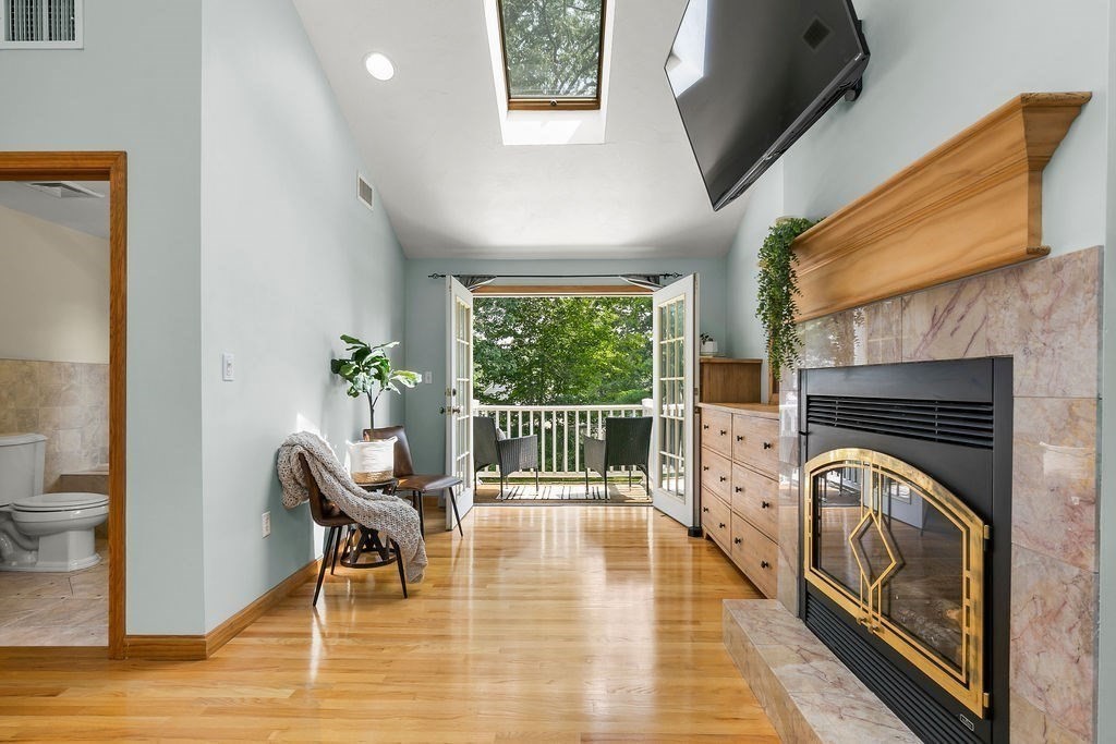 11 Amherst Road Stoughton, MA 02072 - Photo 5 of 42 a view of a hallway with furniture and a fireplace
