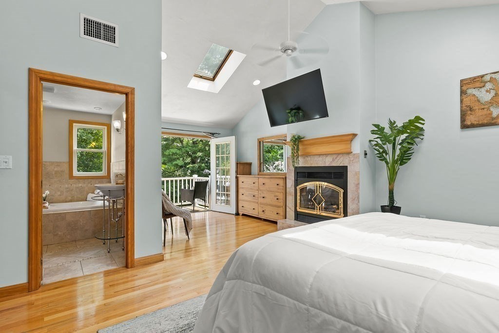 11 Amherst Road Stoughton, MA 02072 - Photo 6 of 42 a bedroom with a bed and a fireplace