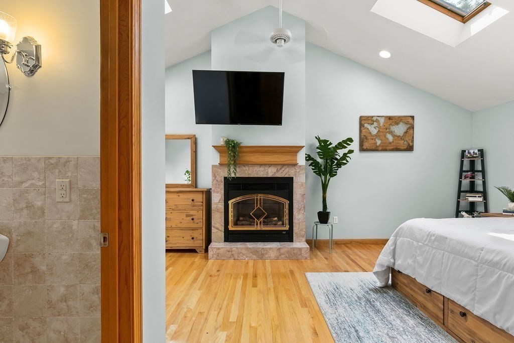 11 Amherst Road Stoughton, MA 02072 - Photo 8 of 42 a living room with furniture and a fireplace