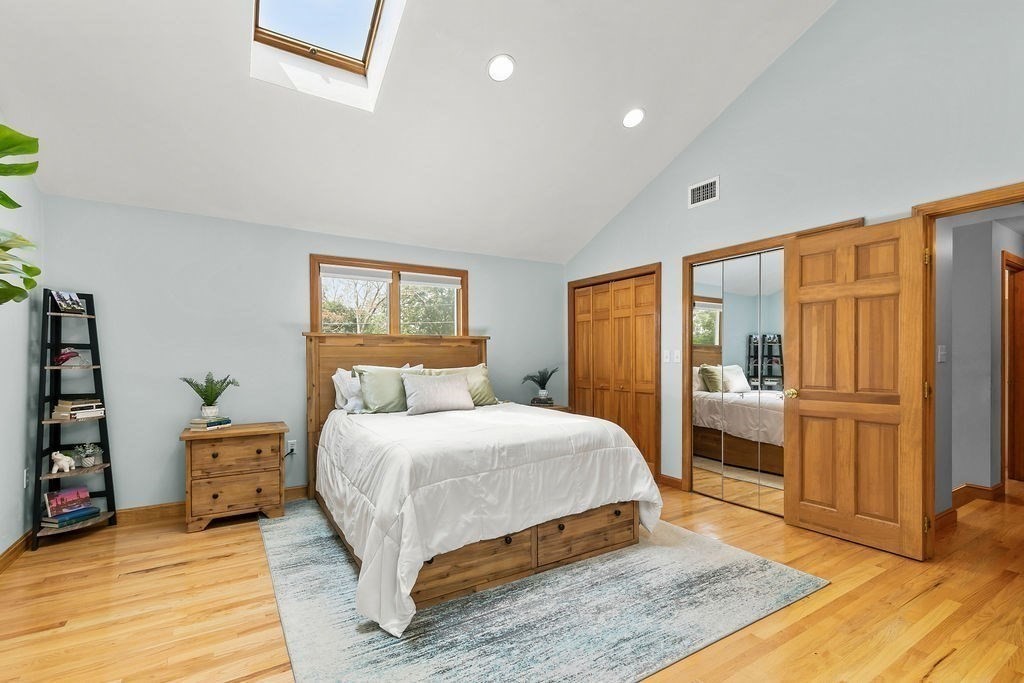 11 Amherst Road Stoughton, MA 02072 - Photo 10 of 42 a bedroom with a large bed and a wooden floor