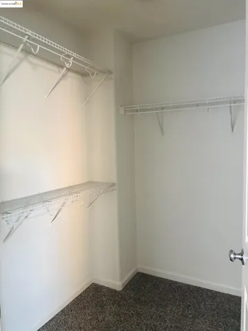 a view of an empty walk in closet
