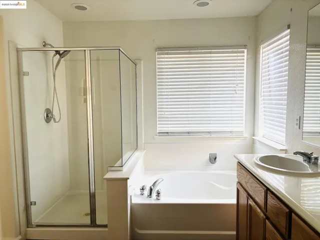 a bathroom with a bathtub and a sink
