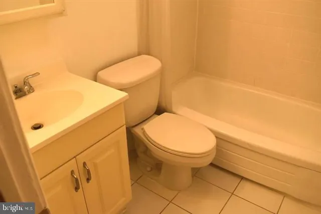 a bathroom with a toilet and a sink