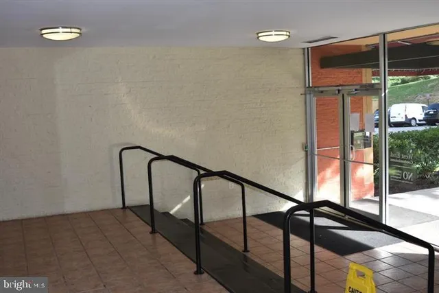 a view of a swimming pool with outdoor seating