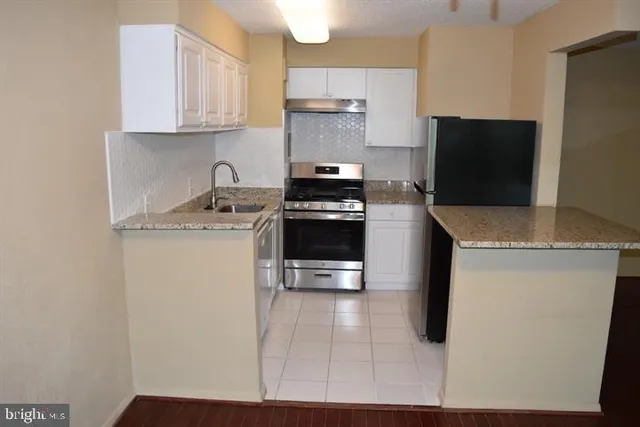 a kitchen with a stove and a microwave