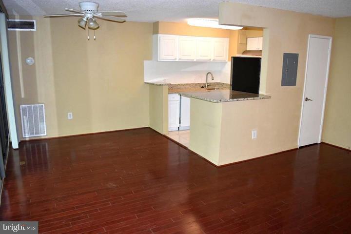 4 South Van Dorn Street, Unit 503 Alexandria, VA 22304 - Photo 9 of 21 a view of kitchen and wooden floor