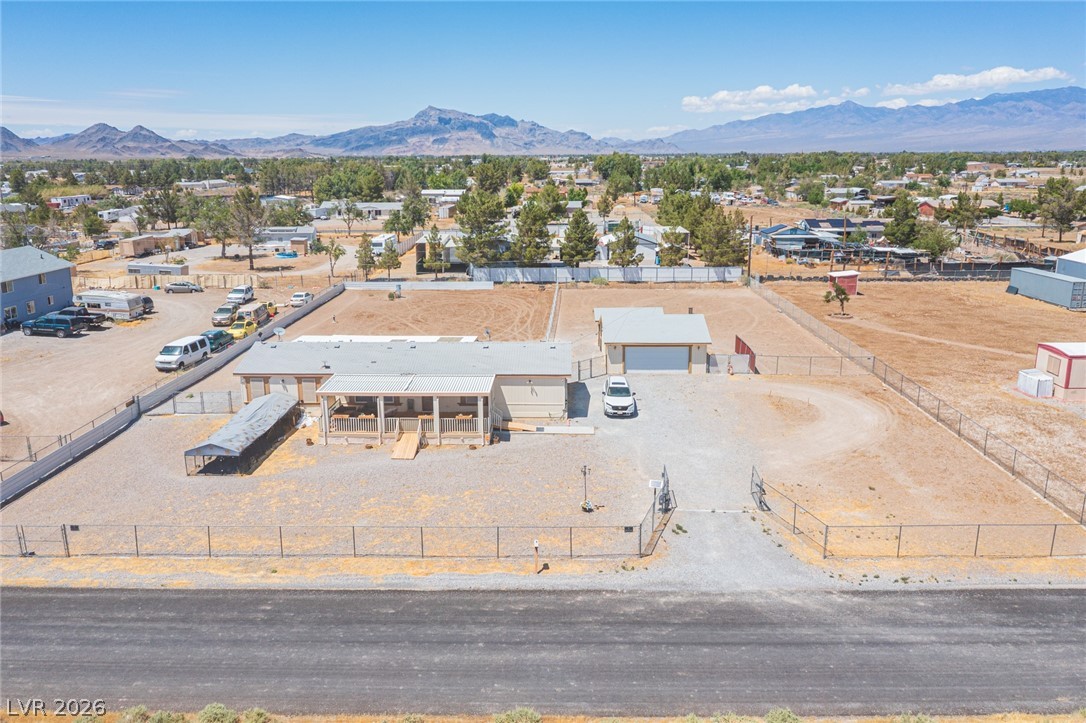 A spacious desert property offering privacy, ample parking, and mountain views.
