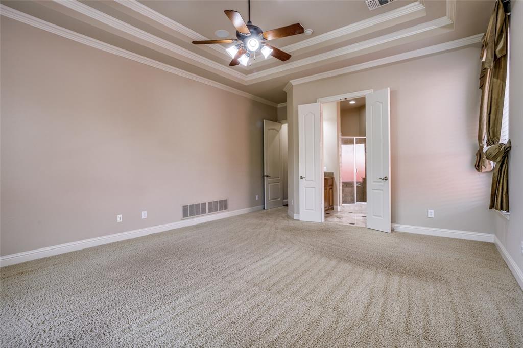 1212 Rio Grande Court Allen, TX 75013 - Photo 18 of 34 a view of a livingroom with a chandelier fan and windows