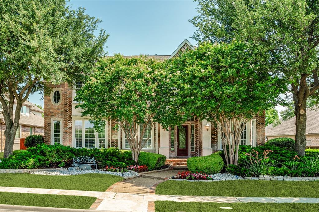 1212 Rio Grande Court Allen, TX 75013 - Photo 2 of 34 a front view of a house with a yard and a garden