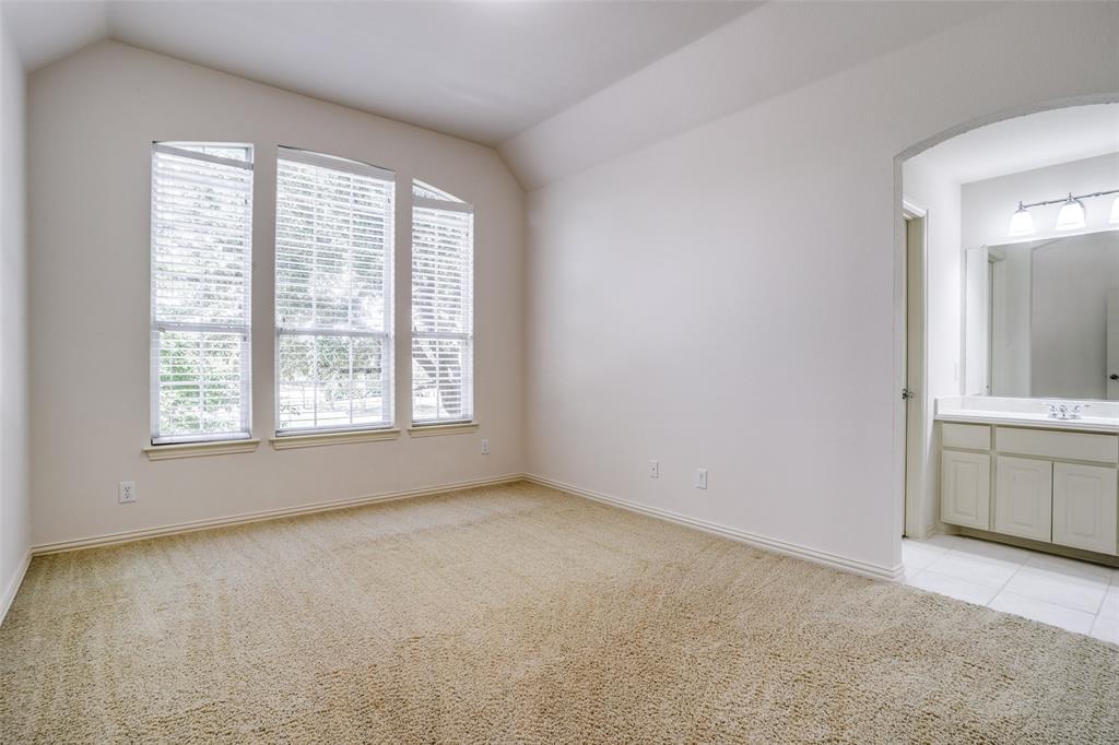 1212 Rio Grande Court Allen, TX 75013 - Photo 23 of 34 an empty room with windows and cabinet