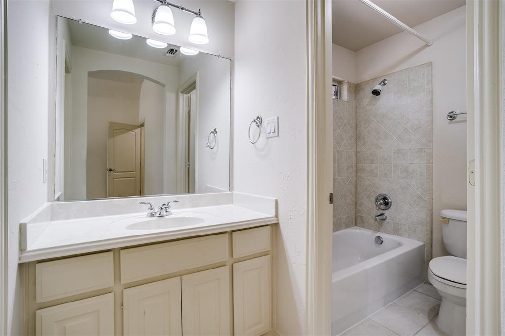 1212 Rio Grande Court Allen, TX 75013 - Photo 24 of 34 a bathroom with a sink a toilet and a bathtub