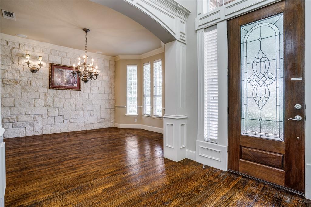 1212 Rio Grande Court Allen, TX 75013 - Photo 3 of 34 a view of an empty room with wooden floor and a window